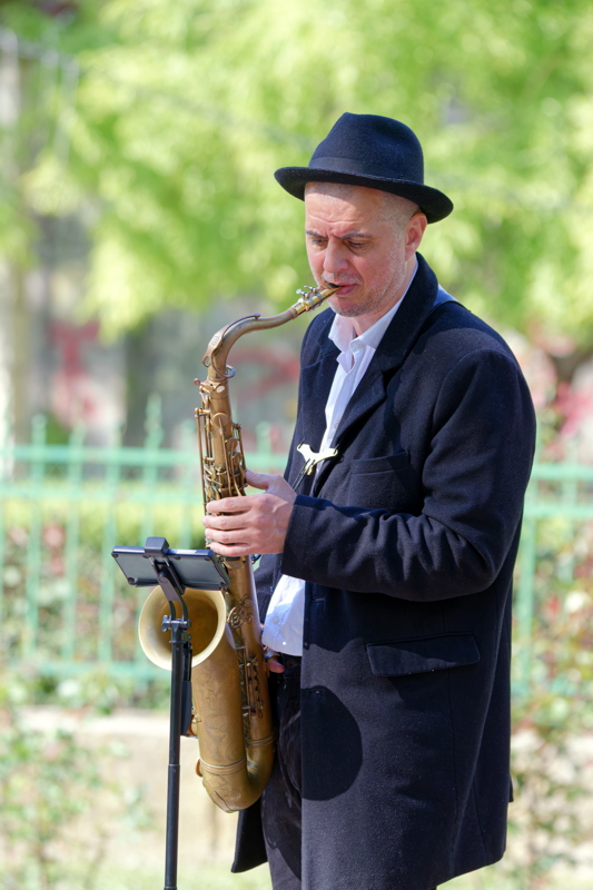 Adult man playing saxophone
